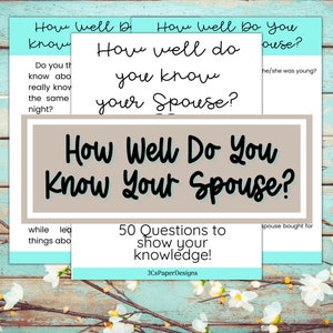 May include: A set of printable cards with the text "How Well Do You Know Your Spouse?" and "50 Questions to show your knowledge!"  The cards are on a light blue wooden background with white flowers.