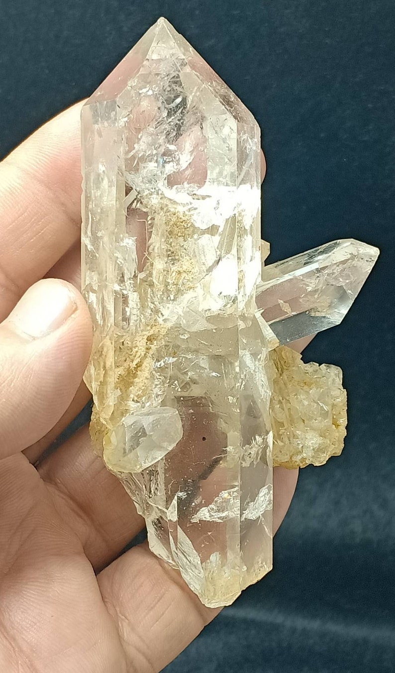 An amazing specimen of very lustrous clear perfectly terminated quartz crystals bunch 180 grams