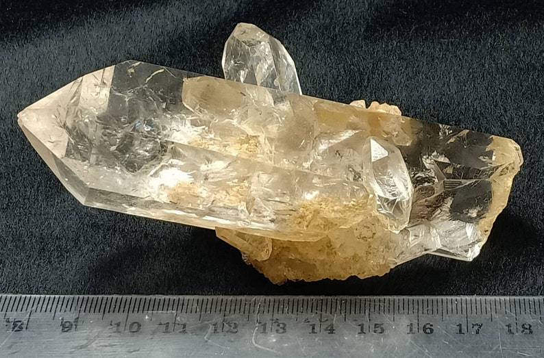 An amazing specimen of very lustrous clear perfectly terminated quartz crystals bunch 180 grams