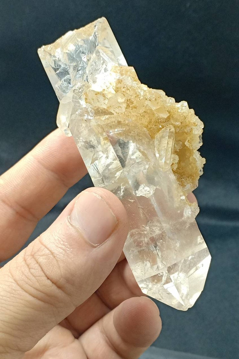 An amazing specimen of very lustrous clear perfectly terminated quartz crystals bunch 180 grams