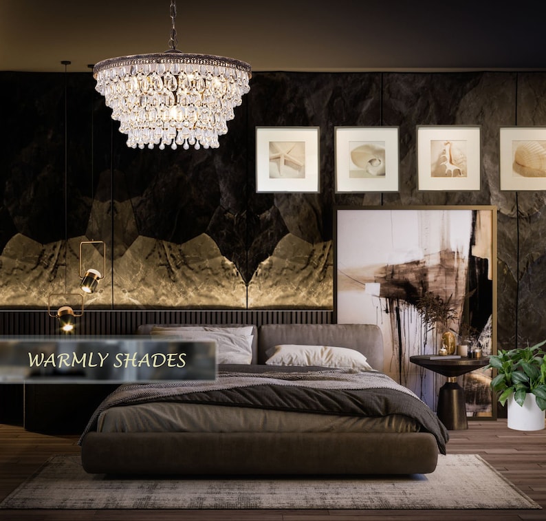 May include: A bedroom with a large bed, a crystal chandelier, and a dark brown wall with a large abstract painting. The bed has a brown headboard and a brown and white patterned comforter. There is a small table next to the bed with a plant on it. The text "Warmly Shades" is visible in the lower left corner of the image.