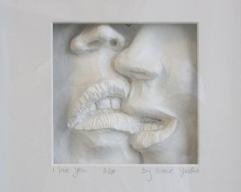 I Love You - a couple whispering to each other &quot;I love you&quot; depicted as a bas-relief in a box frame