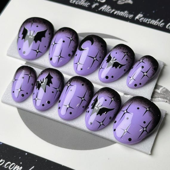 20 Halloween Nail Ideas With Ghosts, Bats and Spooky Details 14 Purple Bats and Stars