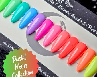 May include: A collection of pastel neon press-on nails in various colors, including green, teal, blue, purple, pink, and orange. The nails are displayed on a card with the text "LD Nails" and "Pastel Neon Collection."