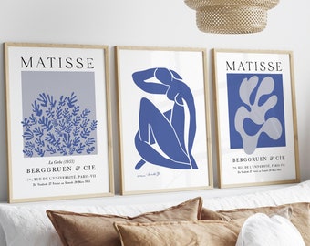 May include: Three framed art prints with a blue and gray color scheme. The prints feature abstract designs by Henri Matisse. The text on the prints reads "MATISSE" and "BERGGRUEN & CIE".