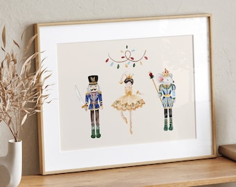 May include: A framed watercolor illustration of a Nutcracker, a ballerina, and a mouse king. The Nutcracker is wearing a blue and gold uniform and holding a sword. The ballerina is wearing a gold dress and a crown. The mouse king is wearing a blue and gold uniform and holding a scepter. The illustration is set against a light beige background with a garland of lights.