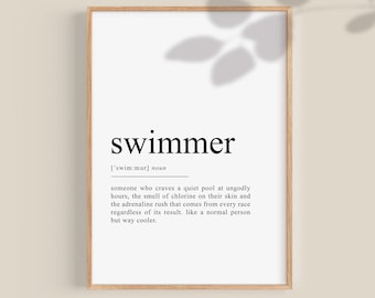 May include: A black and white printable art print with the word "swimmer" defined as someone who enjoys swimming in a pool. The print is framed in a light brown wood frame.