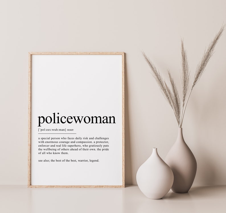 May include: A black and white printable poster with the definition of the word "policewoman". The definition reads: "A special person who faces daily risk and challenges with enormous courage and compassion. A protector, enforcer and real life superhero, who graciously puts the wellbeing of others ahead of their own. The pride of all who know them. See also: the best of the best, warrior, legend."