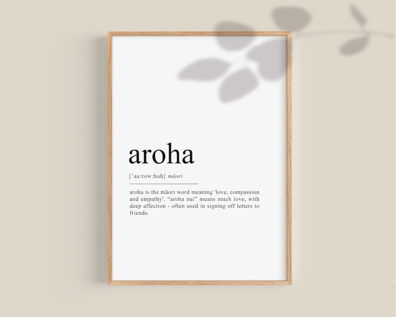 May include: A black and white printable wall art print with a definition of the Maori word "aroha" which means love, compassion, and empathy. The definition is written in a simple, modern font.