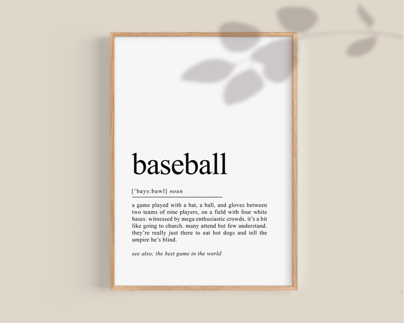 May include: A black and white printable wall art print with the word "baseball" defined as a game played with a bat, a ball, and gloves between two teams of nine players, on a field with four white bases. The definition also includes the phrase "the best game in the world".