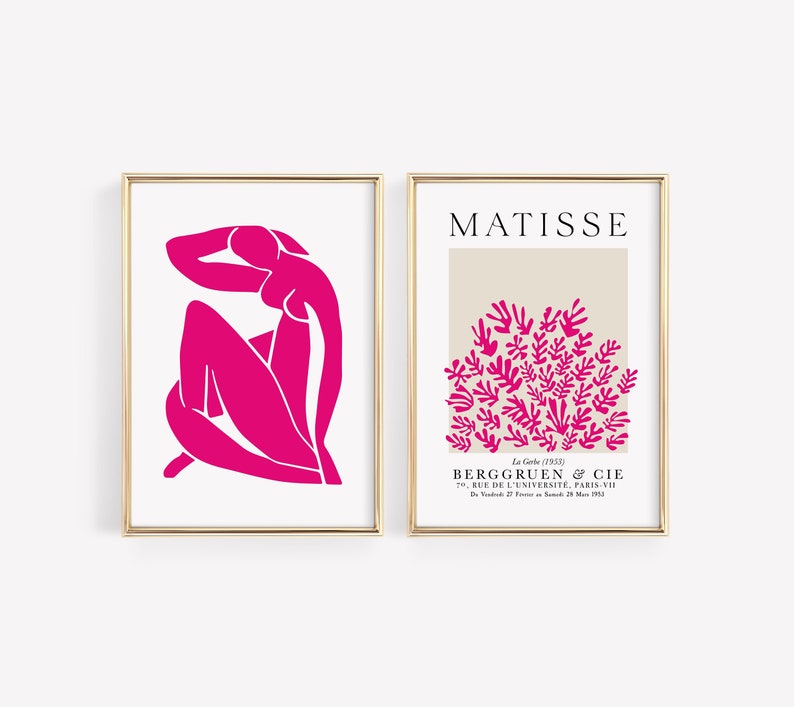 May include: Two framed prints of Matisse artwork. The first print features a pink silhouette of a woman sitting with her arm behind her head. The second print features a pink silhouette of a cluster of leaves on a beige background. The text "MATISSE" is at the top of the second print. The text "La Grle (1953)" is below the image. The text "BERGGRUEN & CIE" is below that. The text "70, RUE DE L'UNIVERSIT&Eacute;, PARIS-VII" is below that. The text "D272815" is below that.
