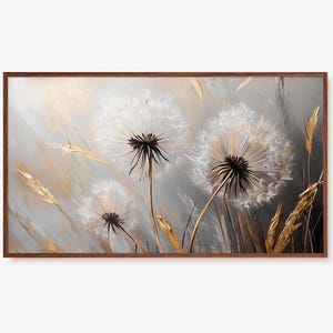 May include: A framed abstract painting of three white dandelion flowers with black centres against a grey and gold background.