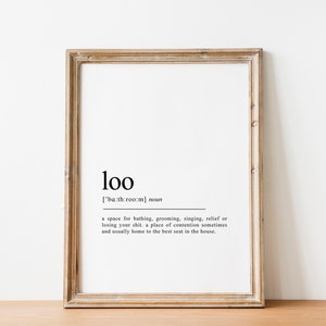 May include: A framed print with the word "loo" defined as a space for bathing, grooming, singing, relief, or losing your shirt. The definition also states that it is a place of contention sometimes and usually home to the best seat in the house.