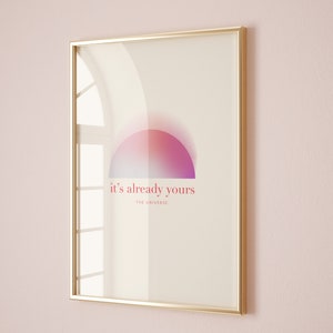 Pode incluir: Uma impressão emoldurada com um círculo degradê rosa e roxo e o texto "it's already yours -THE UNIVERSE- "