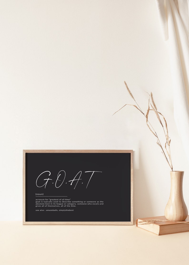 May include: Black and white printable wall art with the acronym GOAT, which stands for "greatest of all time". The definition of GOAT is written below the acronym.