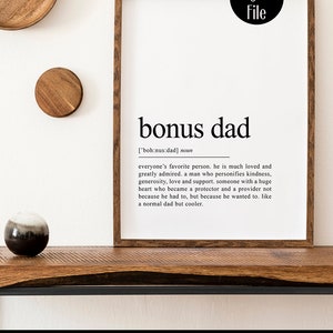 May include: A printable digital file with a black and white definition of "bonus dad" in a wood frame. The definition reads: "everyone's favorite person. He is much loved and greatly admired. A man who personifies kindness, generosity, love and support. Someone with a huge heart who became a protector and a provider not because he had to, but because he wanted to. Like a normal dad but cooler."