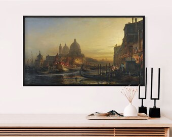 May include: A painting of a canal scene in Venice, Italy. The painting depicts a bustling canal with gondolas and other boats, as well as buildings and a church in the background. The sky is a soft blue with hints of pink and orange, suggesting a sunset.