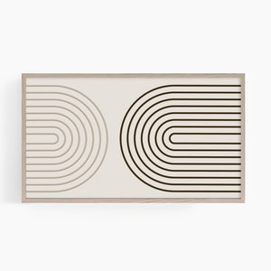 K&ouml;nnte beinhalten: Ein gerahmter abstrakter Kunstdruck mit zwei halbkreisf&ouml;rmigen Designs. Eine Seite hat ein beiges, geschichtetes Bogenmuster, die andere ein dunkelbraunes, durchgehendes Bogenmuster. Der Rahmen ist hellbraun.