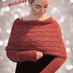 May include: A red knitted scarf with sleeves. The scarf has a diamond pattern and is worn over a black top. The text "L'écharpe avec manches" is written in red on a white background.