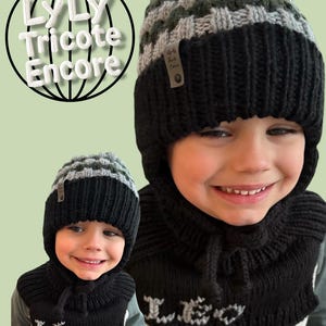 May include: Black and grey knitted hat and neck warmer set with the name "Leo" embroidered on the neck warmer. The hat has a checkered pattern on the top.