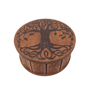 A small round casket in the Celtic style. Tree of life. Celtic gift