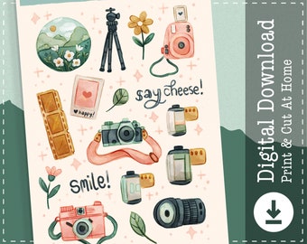 May include: A digital download featuring watercolor illustrations of photography-themed elements. Includes cameras, film rolls, a tripod, and floral accents. Text includes "say cheese!" and "smile!" in a whimsical style. A pink and green color palette.