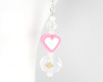 May include: A single dangle earring with a silver hook. The earring features a pink heart-shaped bead with a white center, clear crystal beads, and small white beads. A gold-colored square bead is also present.
