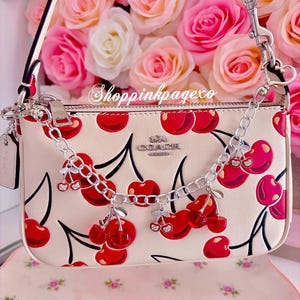 Cherry girl purse charm.