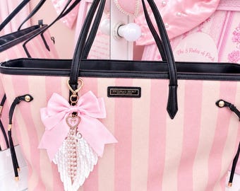 Pink satin bow Angel wings bag charm.