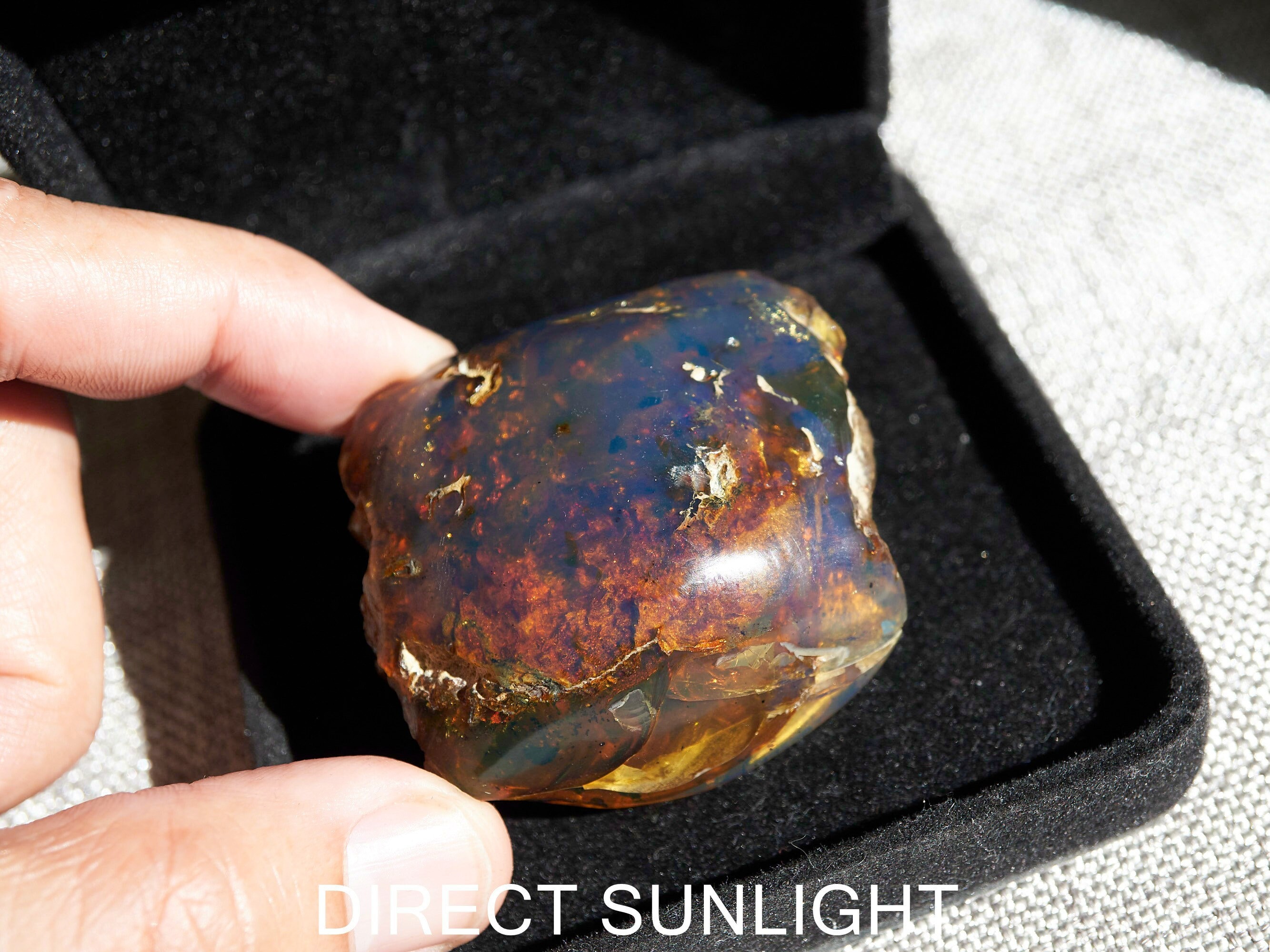 Blue Amber Freeform Cabashon From Sumantra, Indonesia Blue Amber Freeform Cabashon From Sumantra, Indonesia