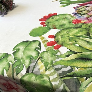 May include: White tablecloth with a green, red, and pink watercolor cactus and tropical leaf design.