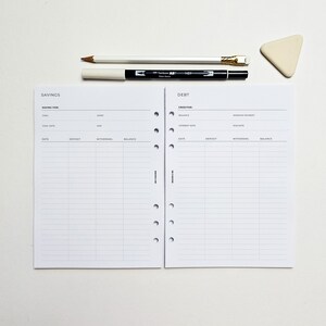 a notepad with a pen on top of it