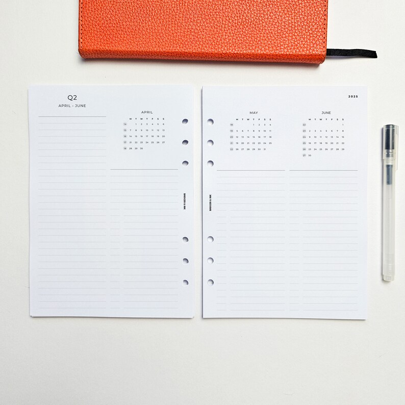 a notepad, pen, and a notebook on a table