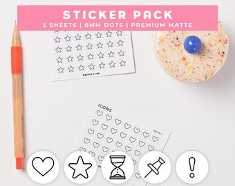 May include: A sticker pack featuring 5 sheets of 8mm dots and premium matte icons. The set includes sheets with star and heart outlines, plus individual circular stickers showing a heart, star, hourglass, pushpin, and exclamation point. An orange pen is included.