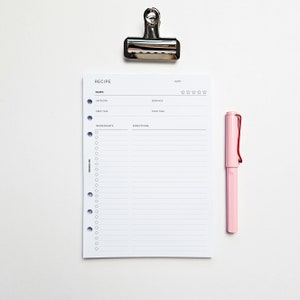 a clipboard with a notepad attached to it