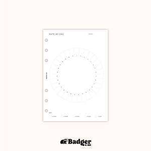 The image is a page from a planner or calendar with a blank circle and various labels and sections for tracking and organizing daily activities.