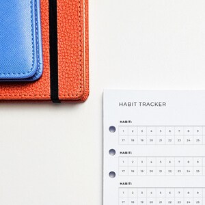 a table with a calendar and a wallet on it