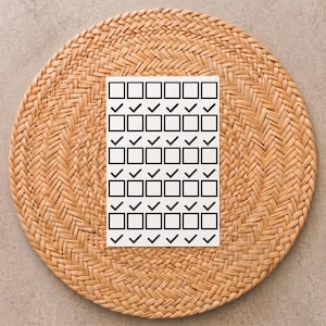 May include: A rectangular white card featuring a repeating grid pattern of black outlined squares and black checkmarks. The design consists of alternating rows of empty squares and rows of squares containing checkmarks, arranged in a structured layout.