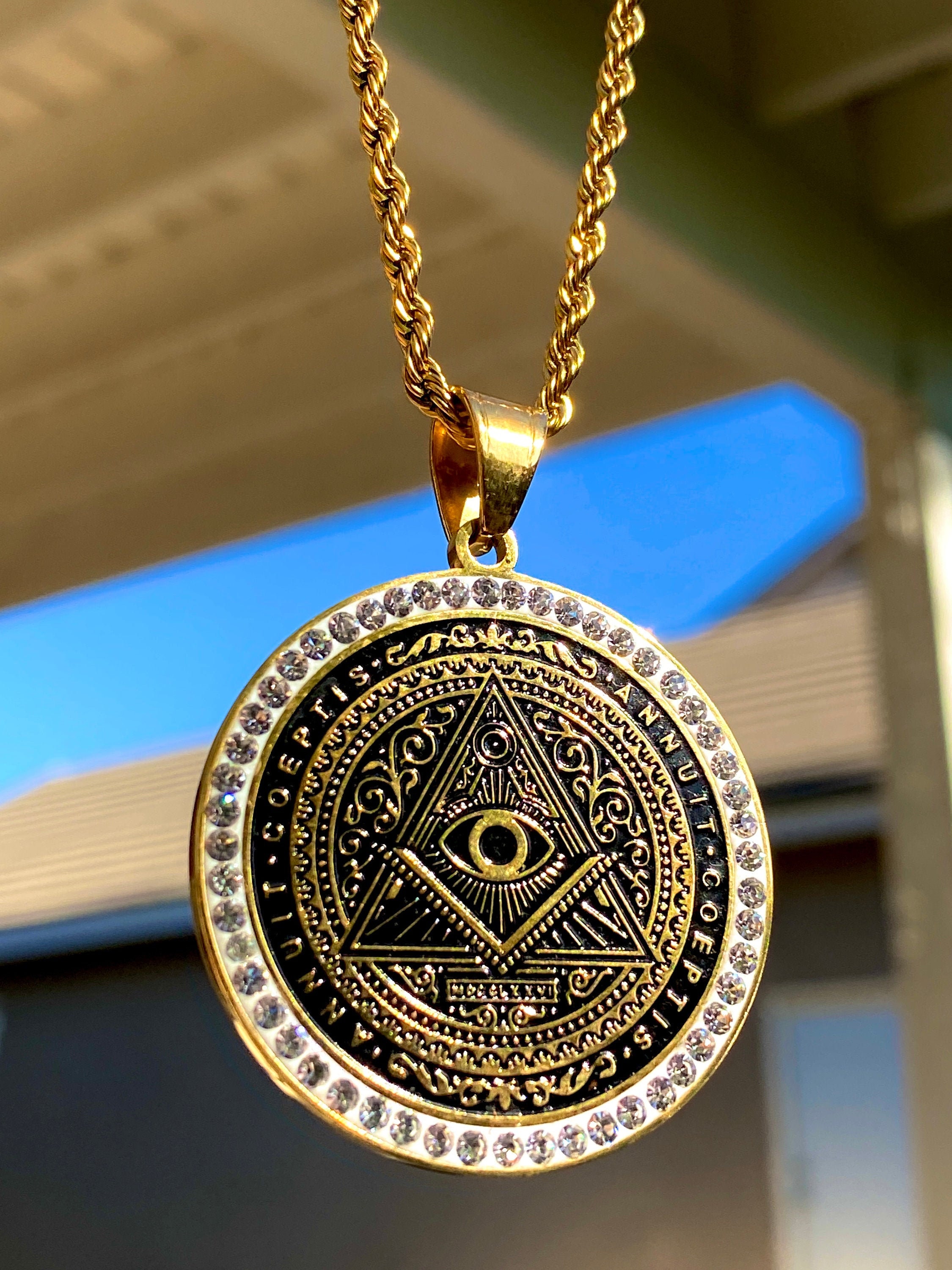Illuminati gold pendant hotsell