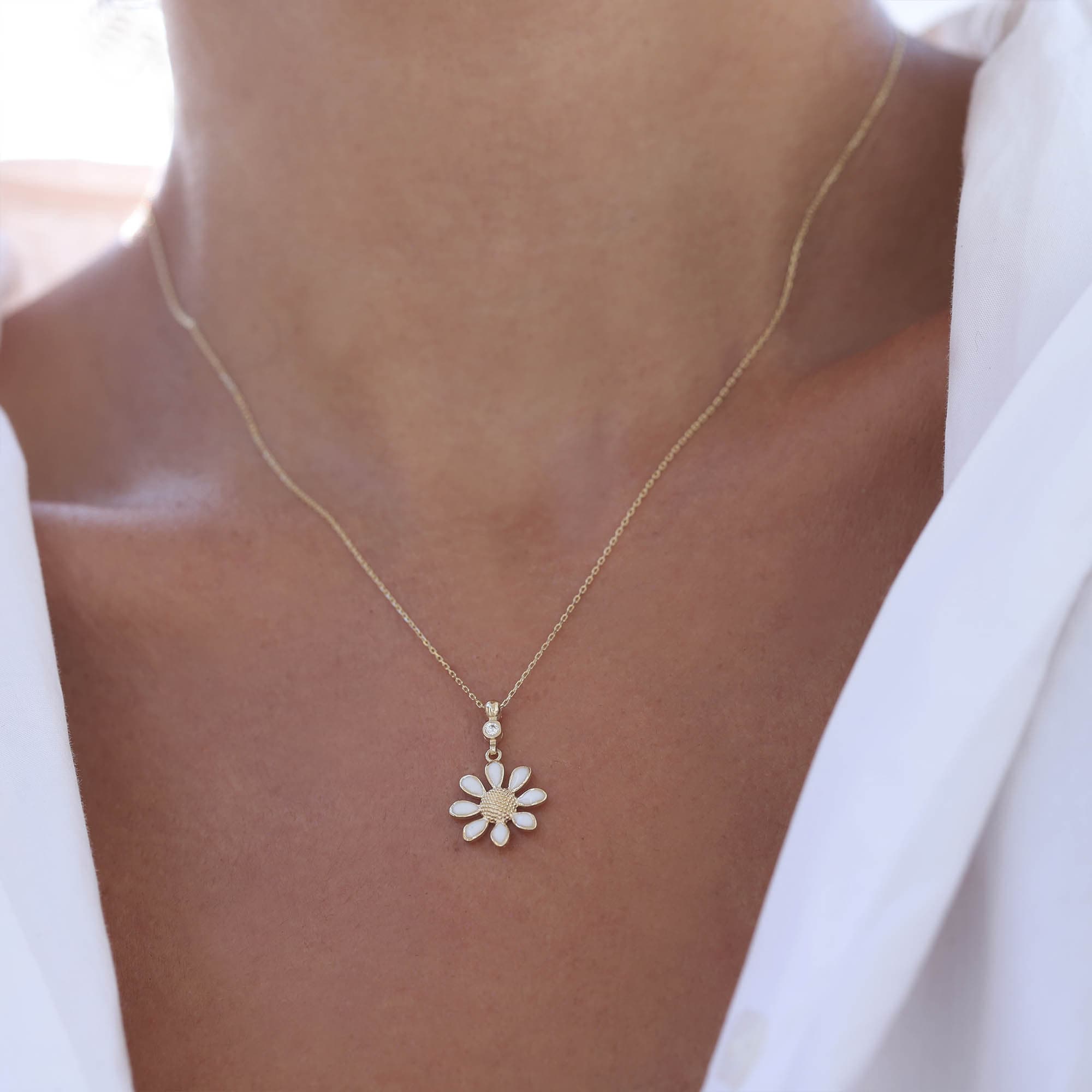 Worn gold daisy necklace