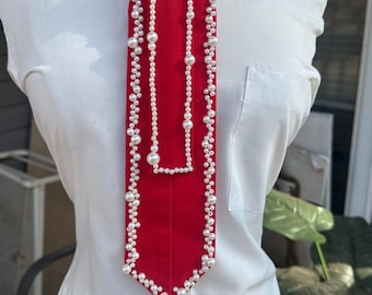 Pearlized Delta Tie (brooch + denim may vary)