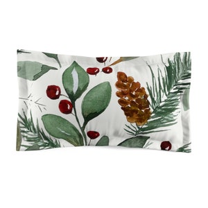 May include: A white pillowcase with a watercolor pattern of pine branches, pine cones, and red berries.