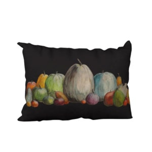 May include: A black pillow featuring a watercolour painting of a selection of gourds and pumpkins in various colours, including green, orange, yellow, and blue.