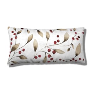 May include: A white lumbar pillow with a watercolor design of brown branches and red berries.