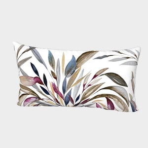 May include: Rectangular decorative pillow with a watercolor botanical design. The pillow features a white background with a pattern of stylized leaves in shades of brown, blue, purple, and gold. The pillow is designed for home decor.