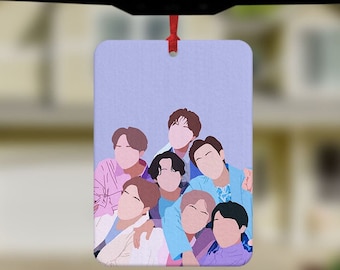 May include: A car air freshener with a purple background featuring a group of cartoon men with different colored shirts.