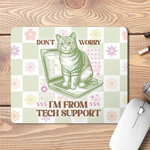 May include: A green and white chequered mouse mat with a cartoon cat sitting on a laptop. The text on the mouse mat reads "Don't Worry I'm From Tech Support".