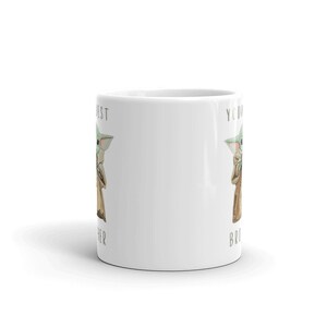 May include: White ceramic mug with a green alien character on each side. The text on the mug reads "You're my best other" and "You're my best bro".