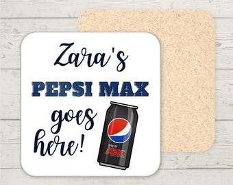 May include: A white square coaster with the text "Zara's PEPSI MAX goes here!" in navy blue script and block letters. A black Pepsi Max can with red and blue accents is also featured. A second, tan coaster is visible.