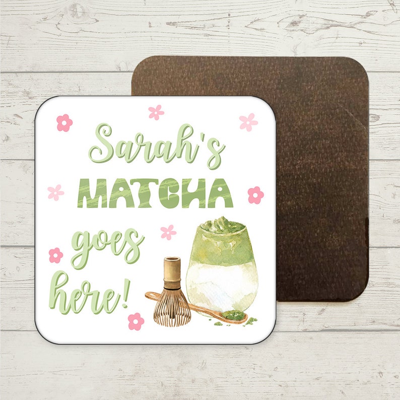 May include: White square coaster with the text "Sarah's Matcha goes here!" in green and pink lettering. A watercolour illustration of a glass of matcha latte with a bamboo whisk and a spoon with matcha powder is in the bottom right corner.
